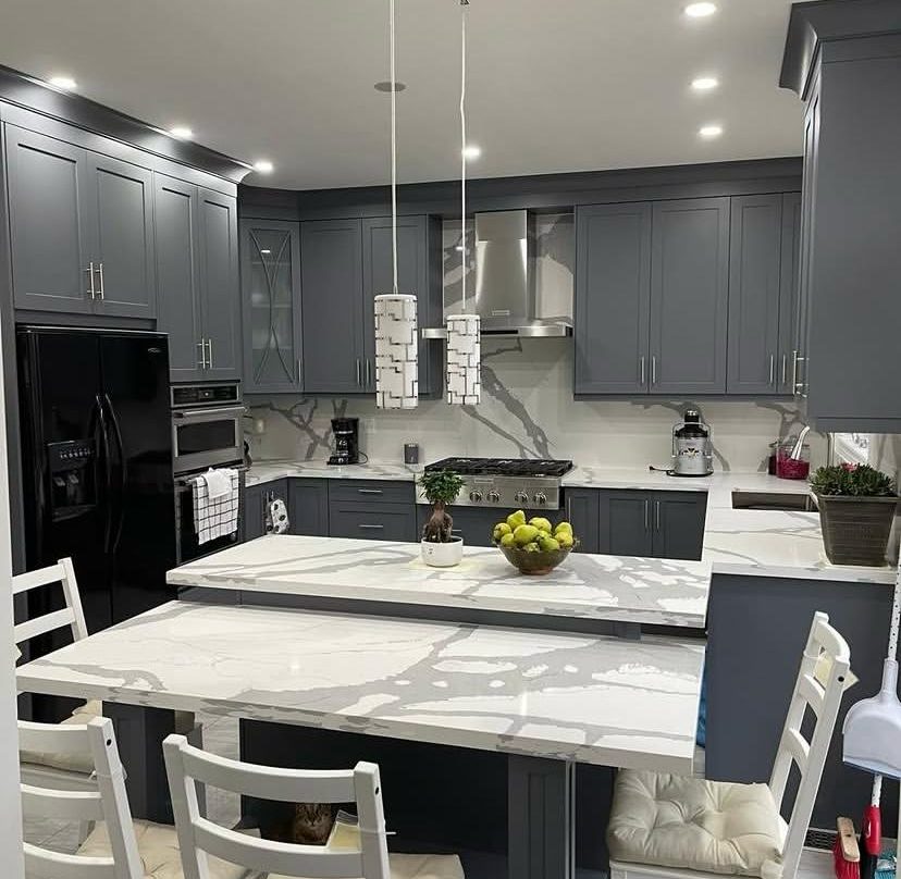 Custom charcoal shaker kitchen with waterfall quartz island